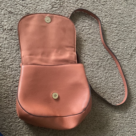 This is a peach color, a crossbody bag from target. - Picture 3 of 4